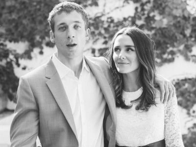 Jeremy Allen White is looking at the camera while Addison Timlin White is looking at him in this monochrome picture.